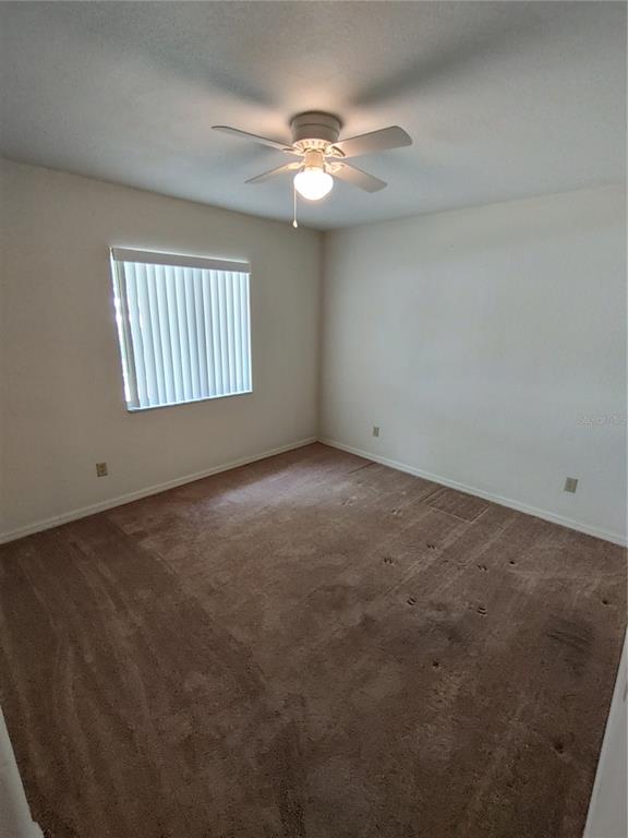 6202 Southwest 100th Loop Ocala, FL 34476 - Photo 11 of 24 an empty room with a window