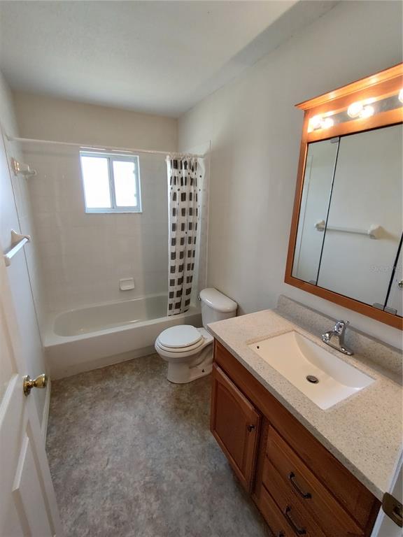 6202 Southwest 100th Loop Ocala, FL 34476 - Photo 14 of 24 a bathroom with a sink a toilet and shower