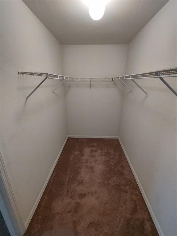 6202 Southwest 100th Loop Ocala, FL 34476 - Photo 18 of 24 a view of a room with racks on the wall