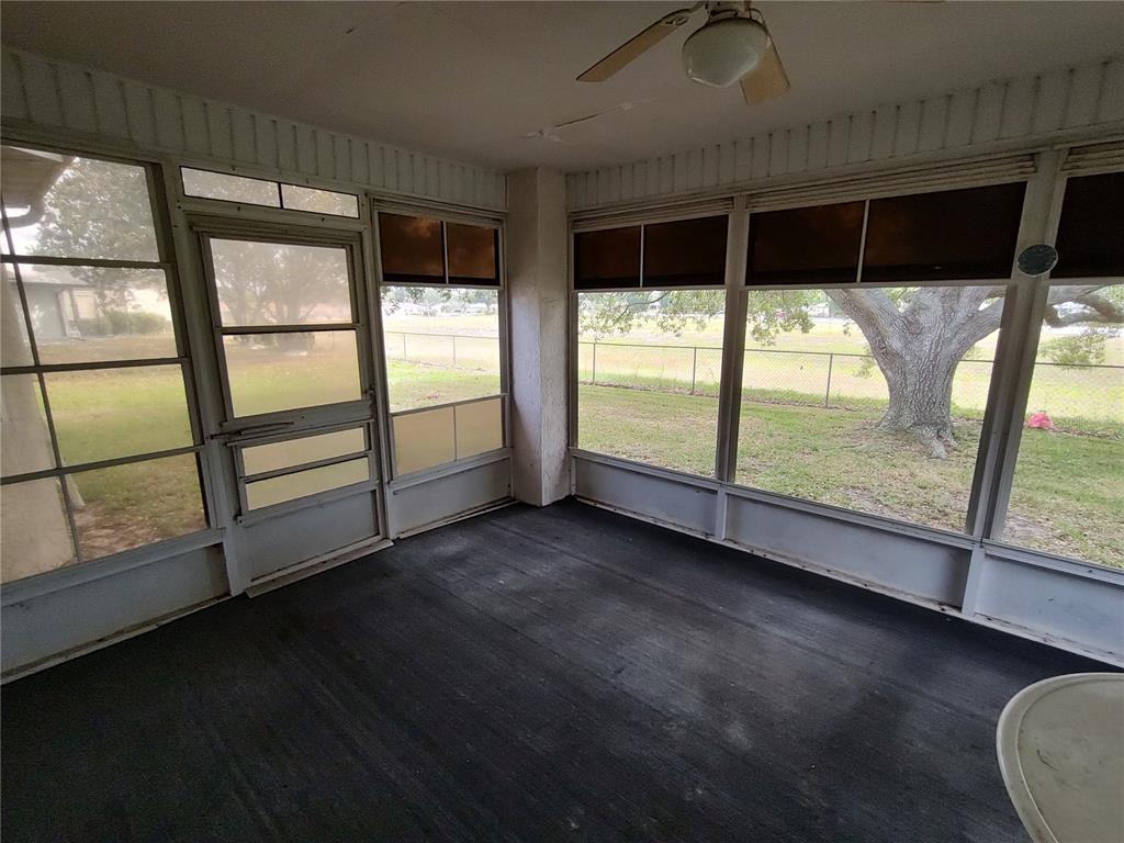 6202 Southwest 100th Loop Ocala, FL 34476 - Photo 20 of 24 a view of a room with window and wooden floor