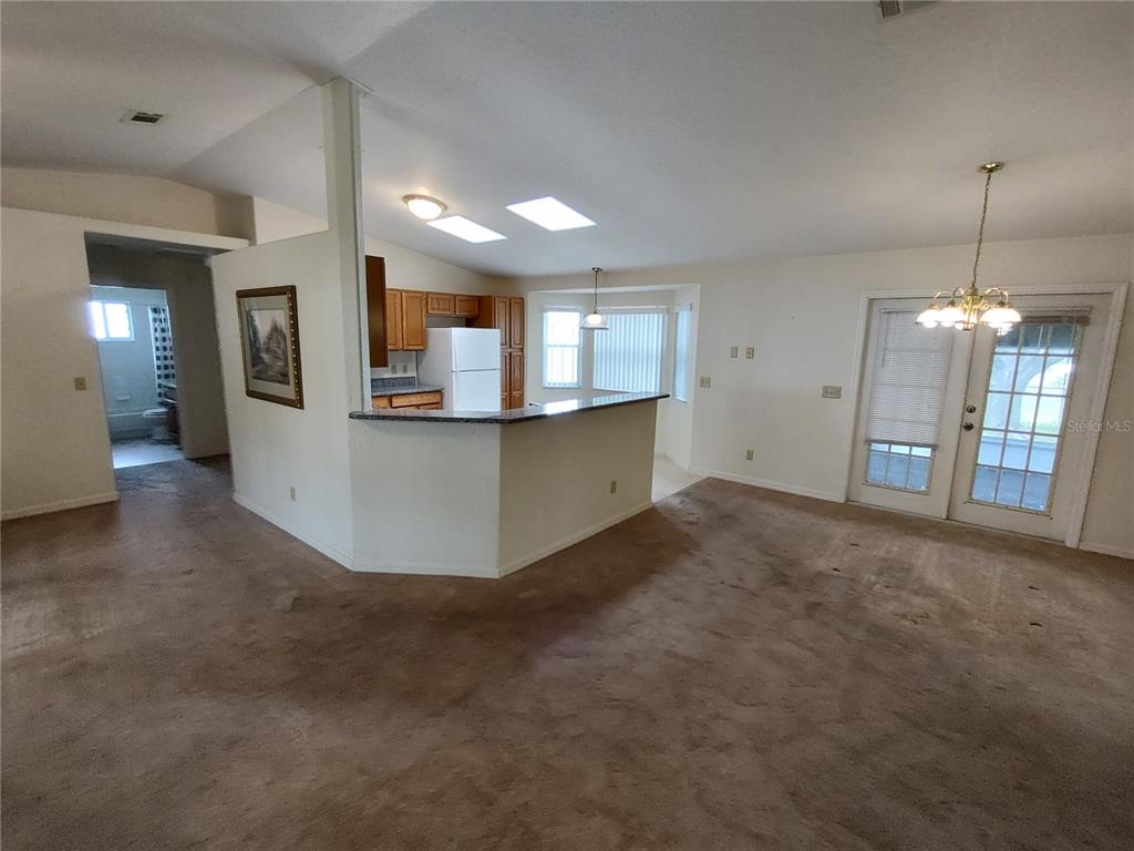 6202 Southwest 100th Loop Ocala, FL 34476 - Photo 5 of 24 a view of a kitchen with refrigerator and a sink