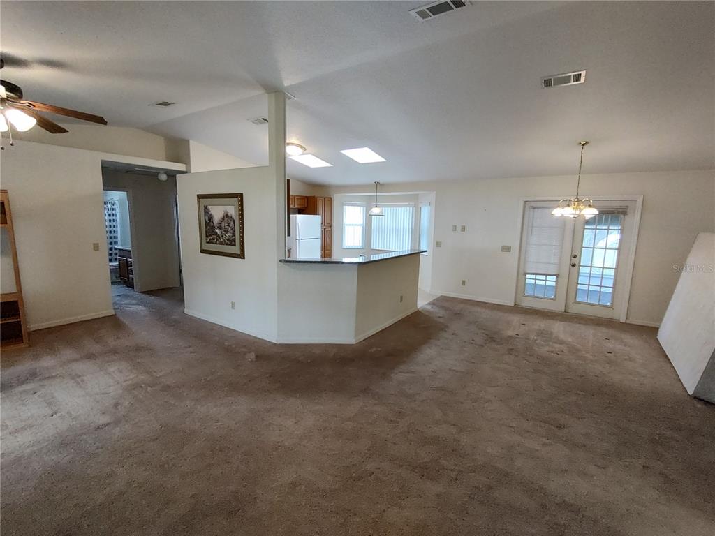 6202 Southwest 100th Loop Ocala, FL 34476 - Photo 6 of 24 a view of a kitchen with a sink and dishwasher a kitchen view