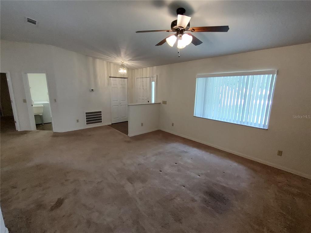6202 Southwest 100th Loop Ocala, FL 34476 - Photo 7 of 24 a view of an empty room with a window
