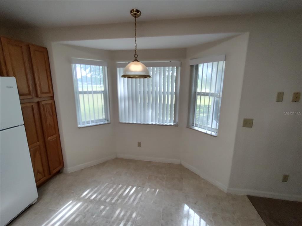 6202 Southwest 100th Loop Ocala, FL 34476 - Photo 9 of 24 a view of an empty room with windows