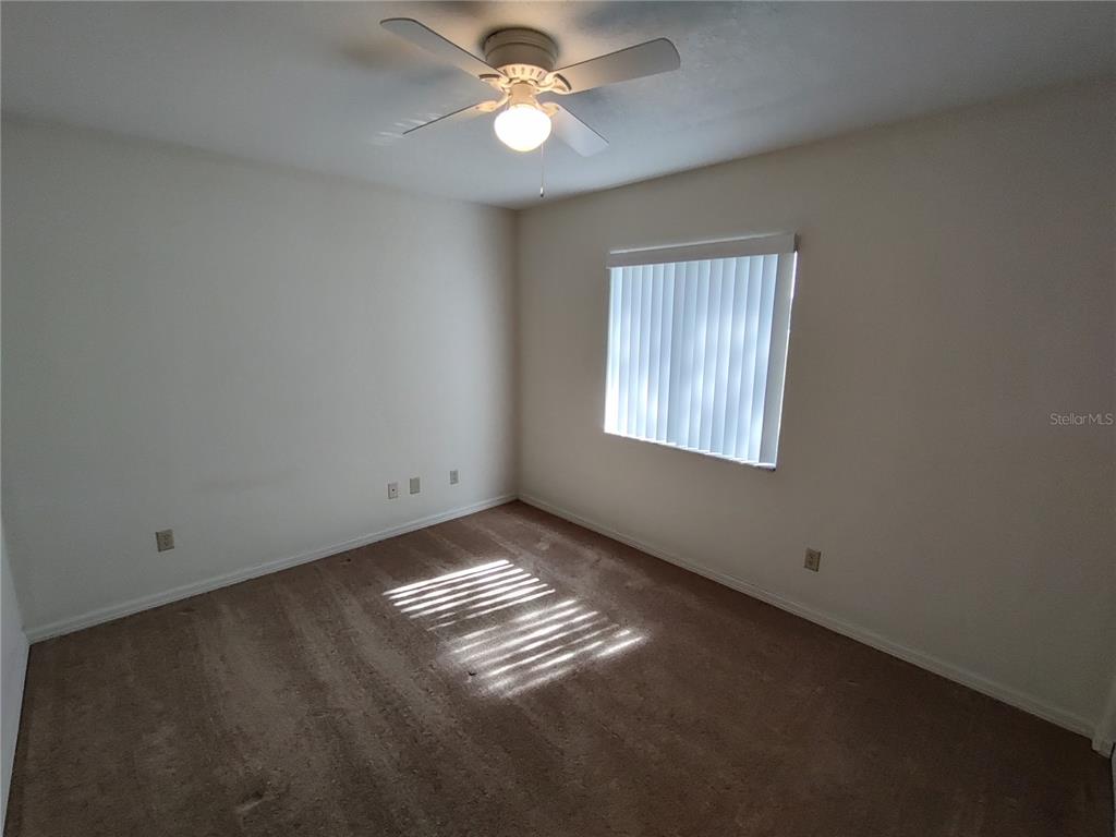 6202 Southwest 100th Loop Ocala, FL 34476 - Photo 10 of 24 a view of an empty room with a window