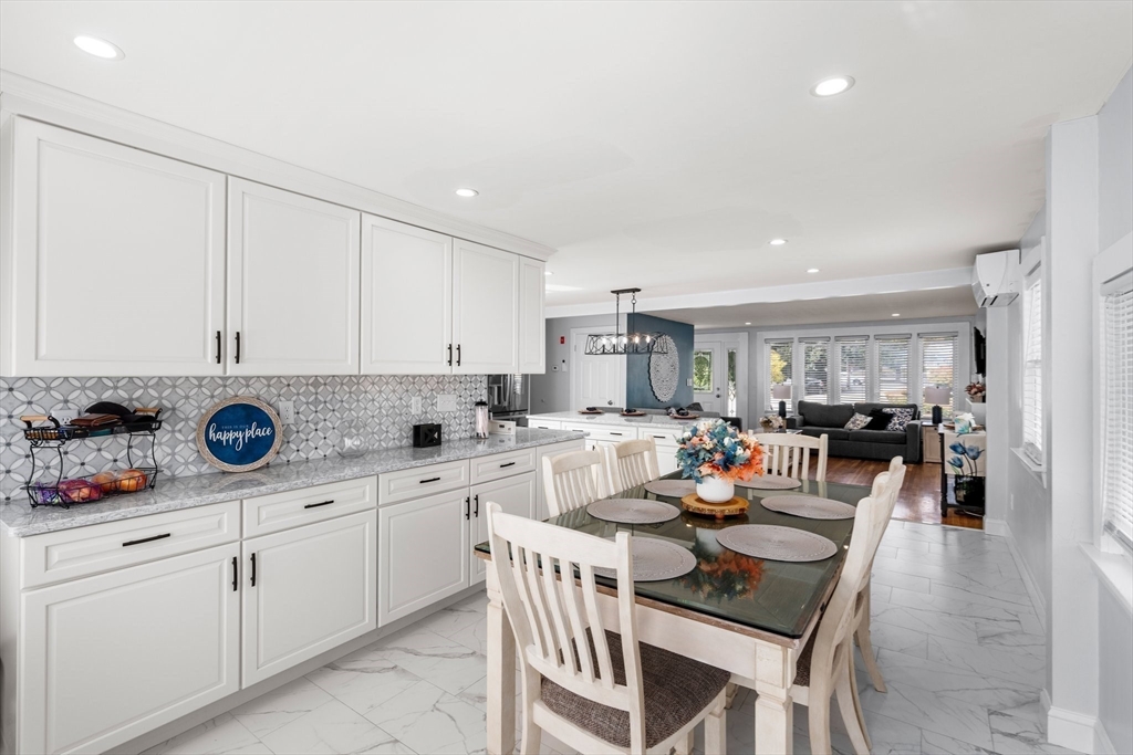 5 Albert Road Peabody, MA 01960 - Photo 11 of 39 a kitchen with a sink dining table and chairs
