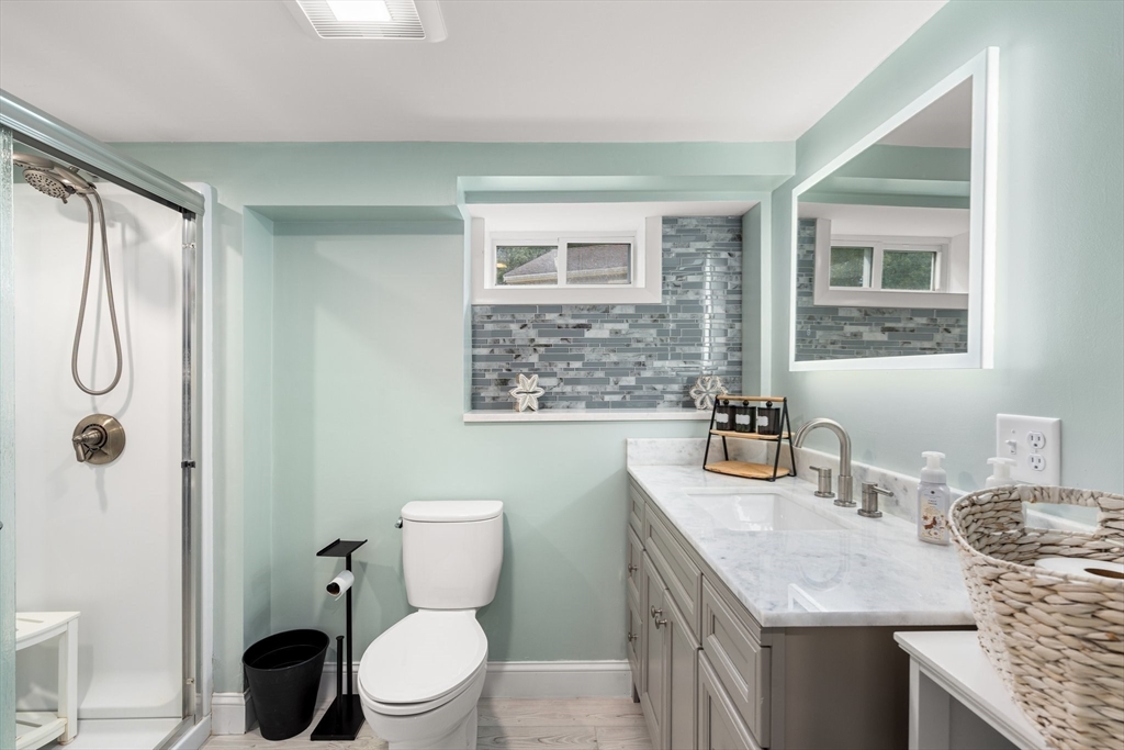 5 Albert Road Peabody, MA 01960 - Photo 18 of 39 a bathroom with a granite countertop sink toilet and shower