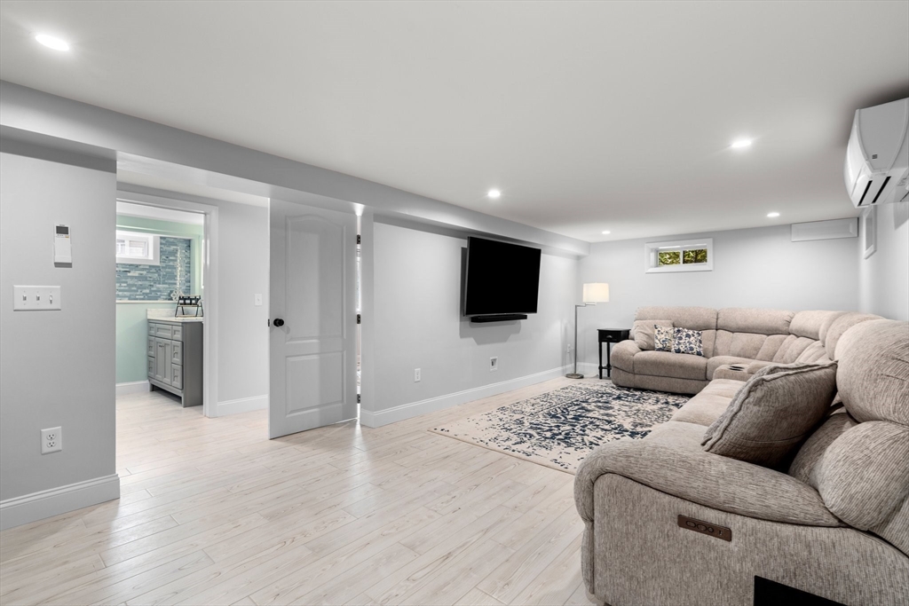 5 Albert Road Peabody, MA 01960 - Photo 20 of 39 a living room with furniture and a flat screen tv