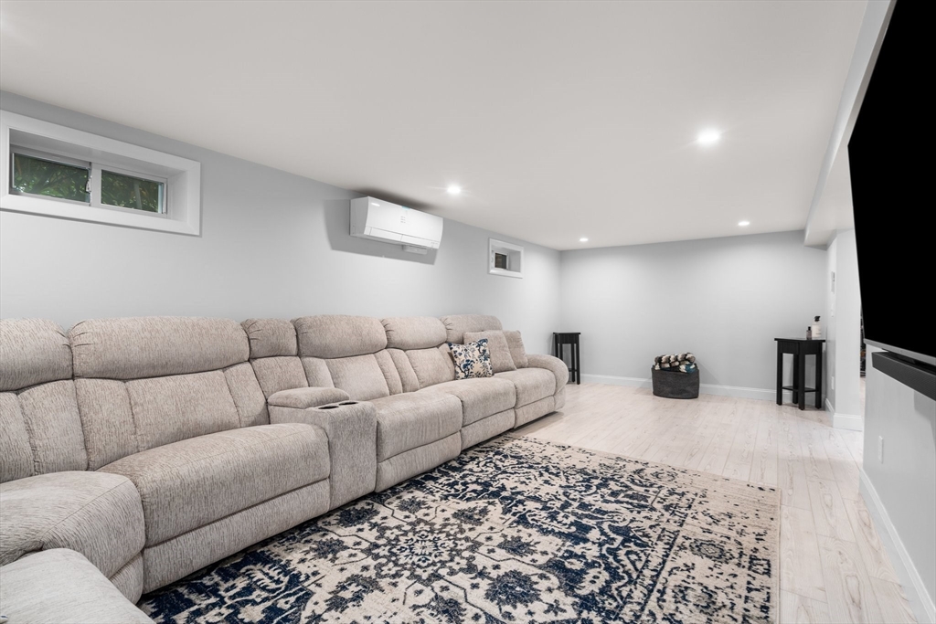5 Albert Road Peabody, MA 01960 - Photo 21 of 39 a living room with furniture and a flat screen tv
