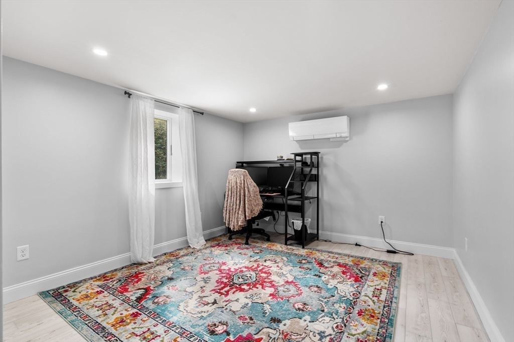 5 Albert Road Peabody, MA 01960 - Photo 22 of 39 a bedroom with furniture and a rug