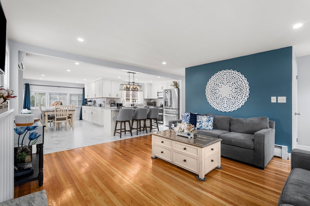 5 Albert Road Peabody, MA 01960 - Photo 4 of 39 a living room with furniture a table and kitchen view