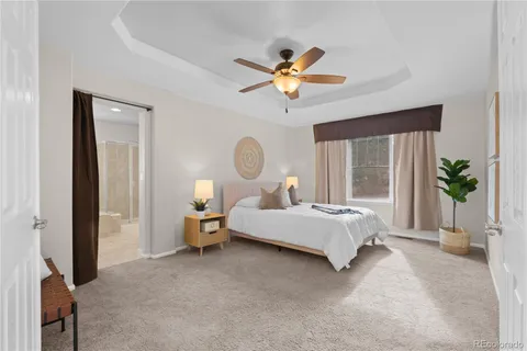 a bed room with a bed and a chandelier