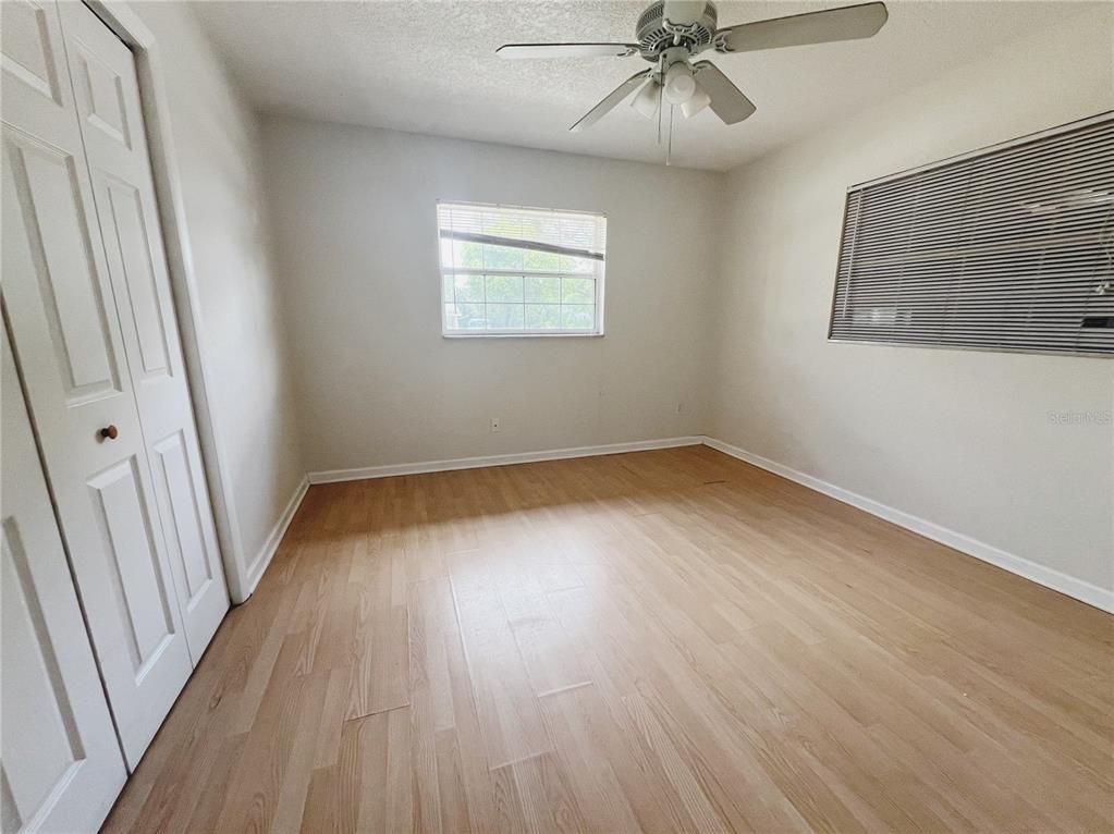 110 Willow Avenue Altamonte Springs, FL 32714 - Photo 7 of 8 wooden floor in an empty room with a window