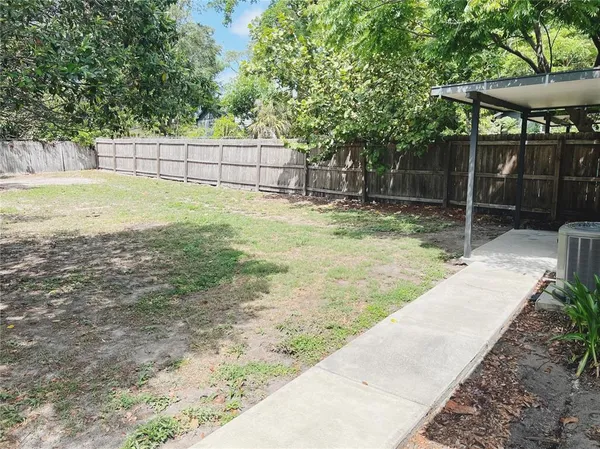 a backyard of a house with lots of green space