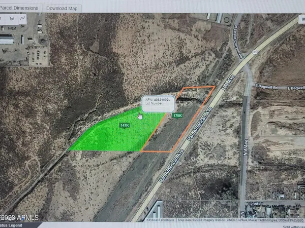 a view of a balcony with a yard