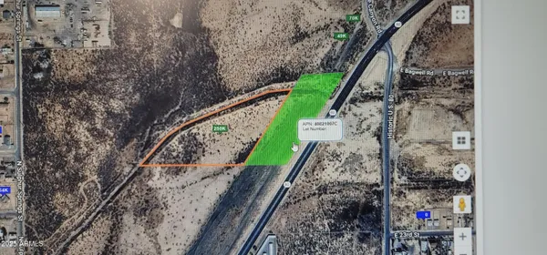 a view of a yard with large trees