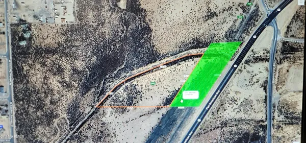 a view of a yard with potted plants