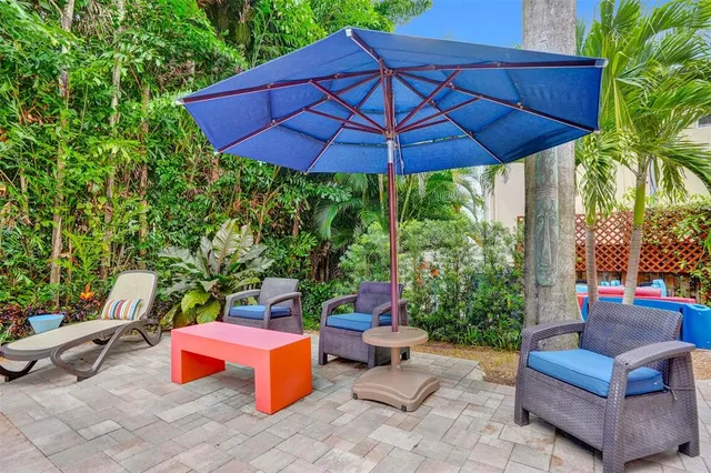 a bathroom with a sink a mirror a vanity and shower