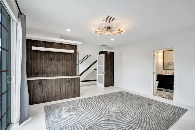 a bathroom with a granite countertop sink a toilet and a mirror