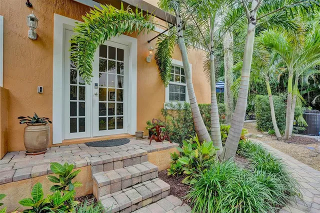 a dining room with lots of furniture and a book shelf