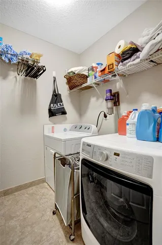 a bathroom with a granite countertop sink and a toilet