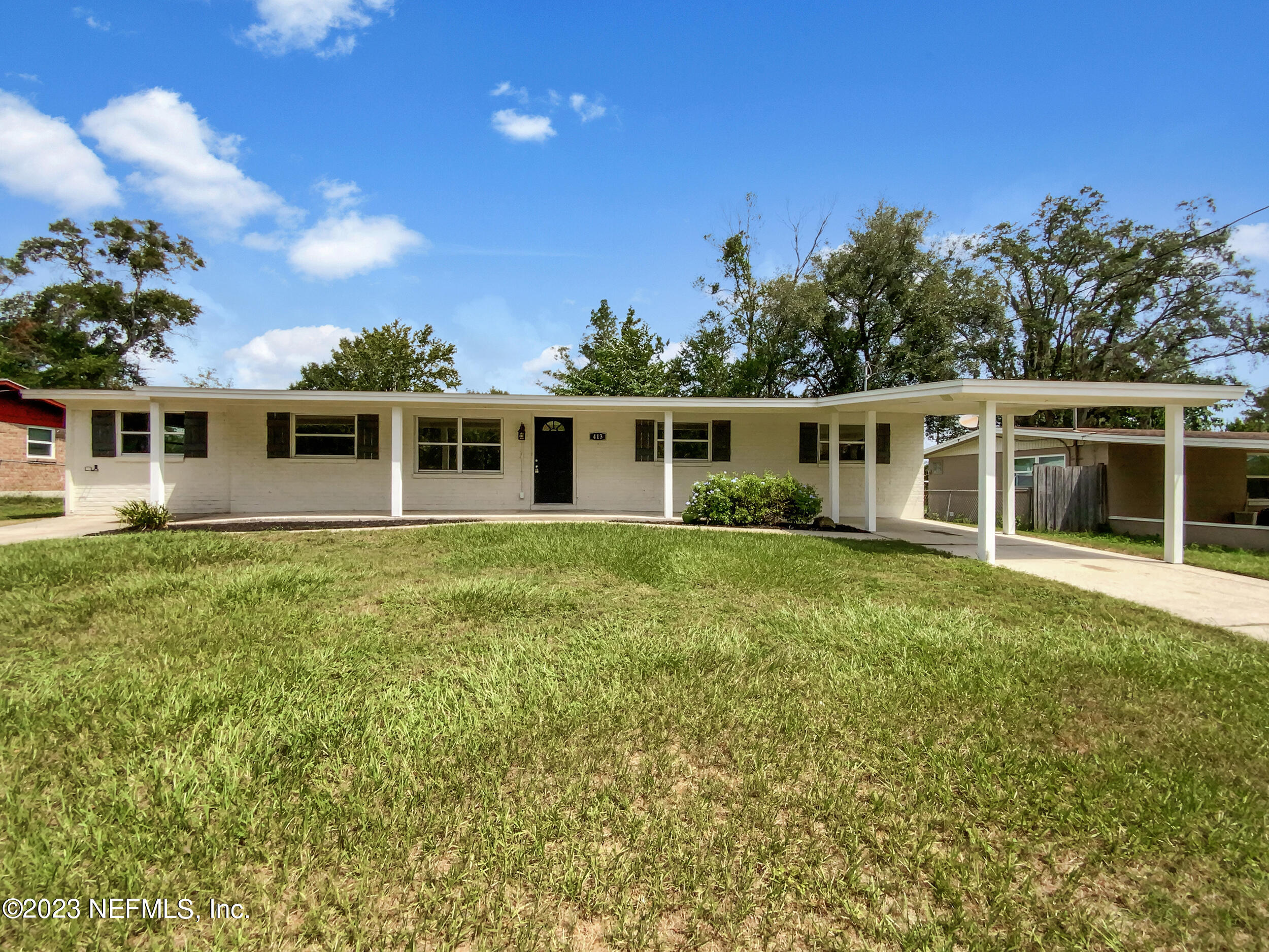 413 Sigsbee Road Orange Park, FL 32073 - Photo 1 of 18 a view of a house with a backyard