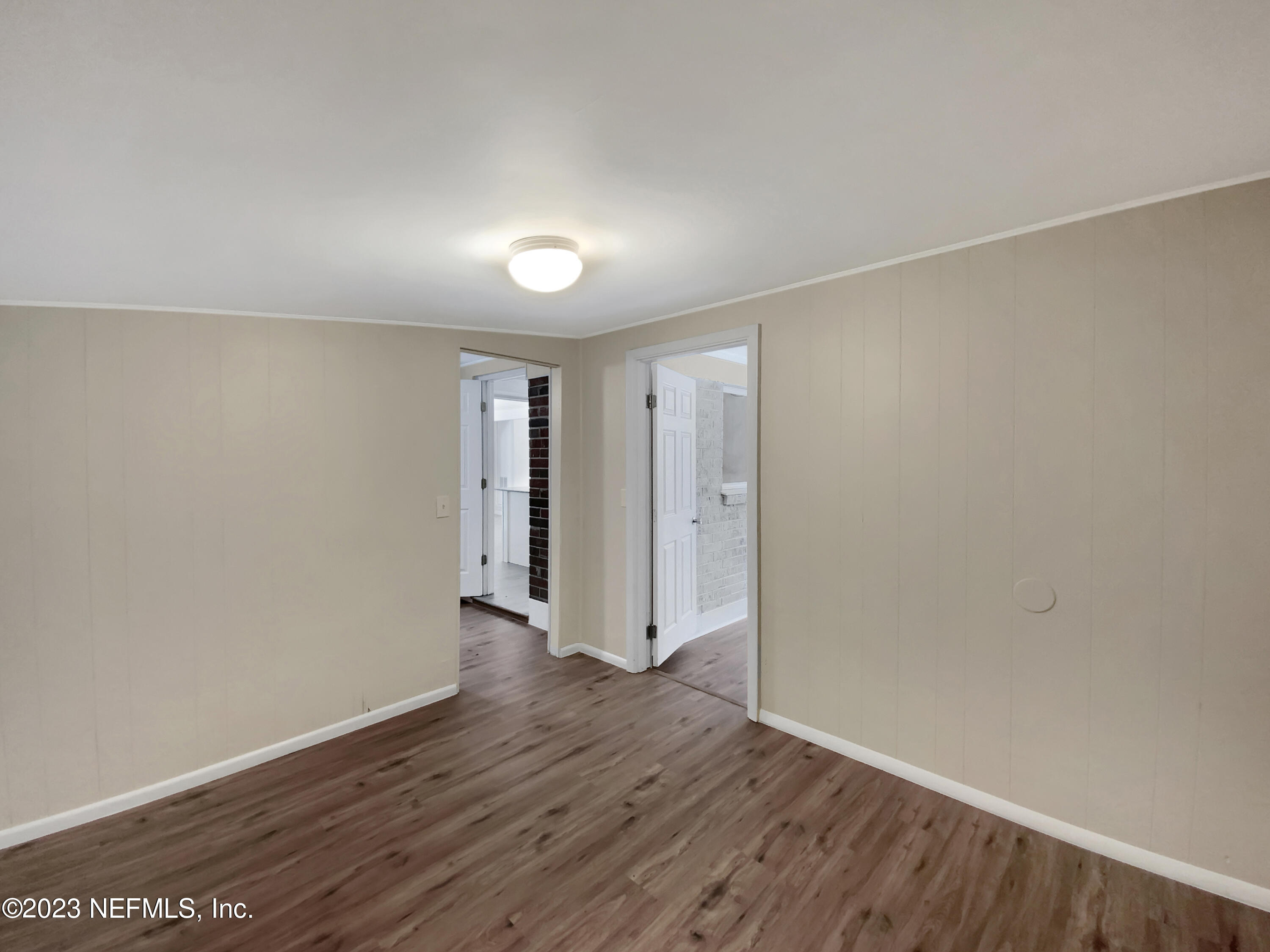 413 Sigsbee Road Orange Park, FL 32073 - Photo 15 of 18 a view of an empty room with wooden floor