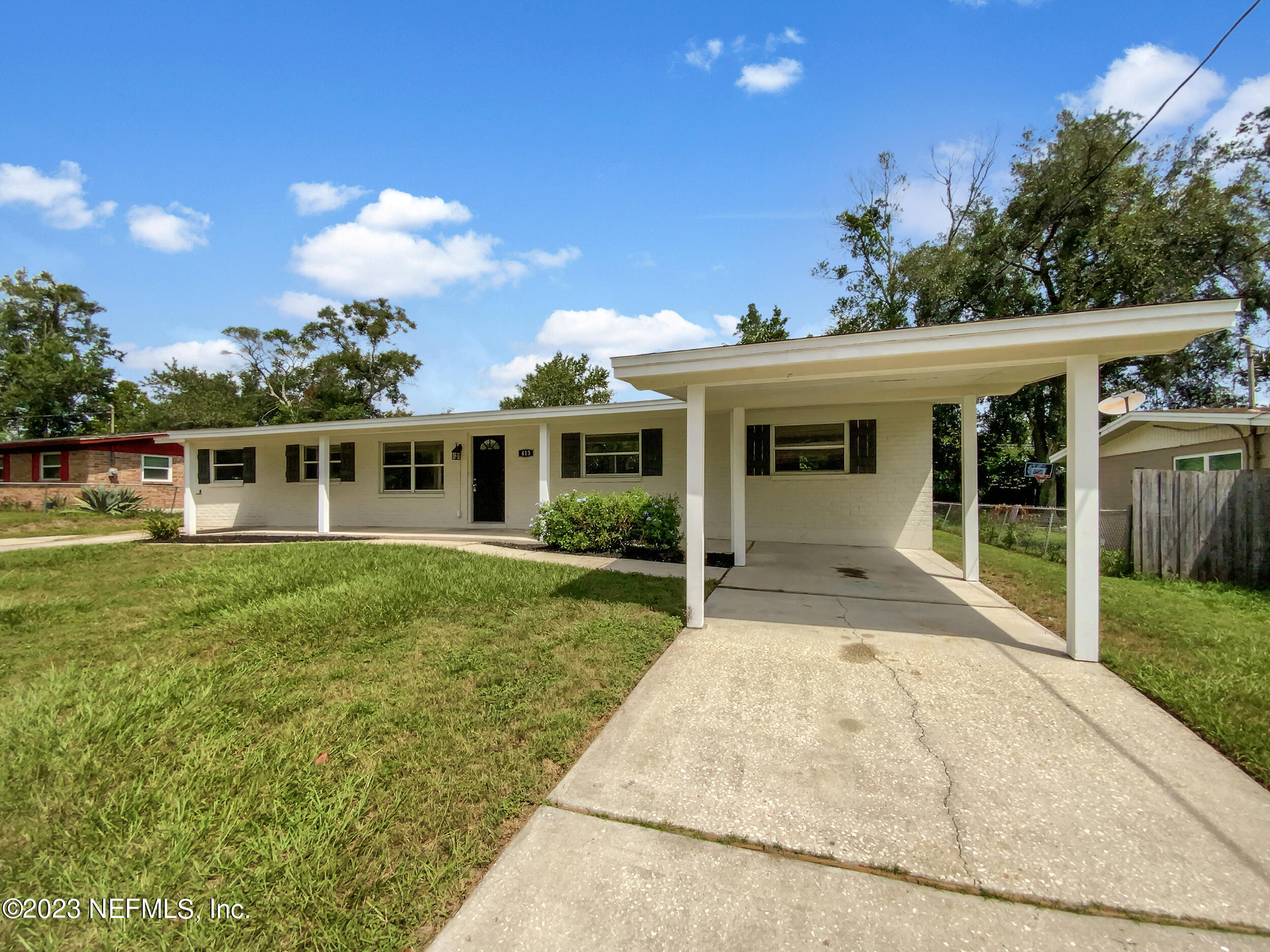 413 Sigsbee Road Orange Park, FL 32073 - Photo 5 of 18 a front view of a house with a yard