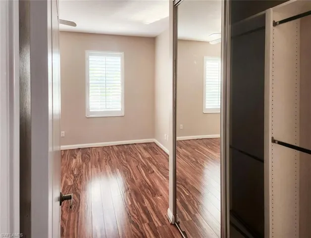 a view of front door with wooden floor