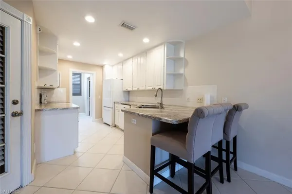 a kitchen with a table and chairs in it