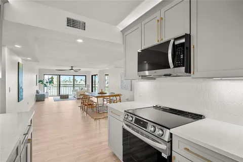 a kitchen with a stove and a microwave