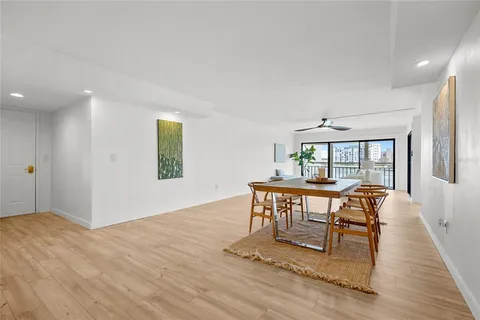 a view of a livingroom with furniture window and wooden floor