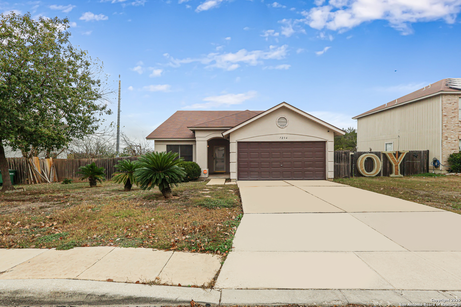 7234 Raintree Forest San Antonio, TX 78233 - Photo 1 of 23 a front view of a house with garage