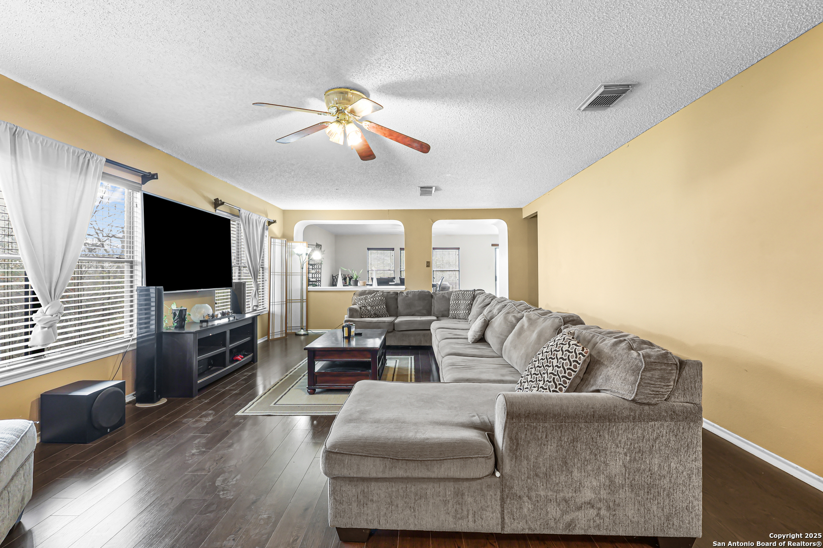 7234 Raintree Forest San Antonio, TX 78233 - Photo 6 of 23 a living room with furniture and a flat screen tv