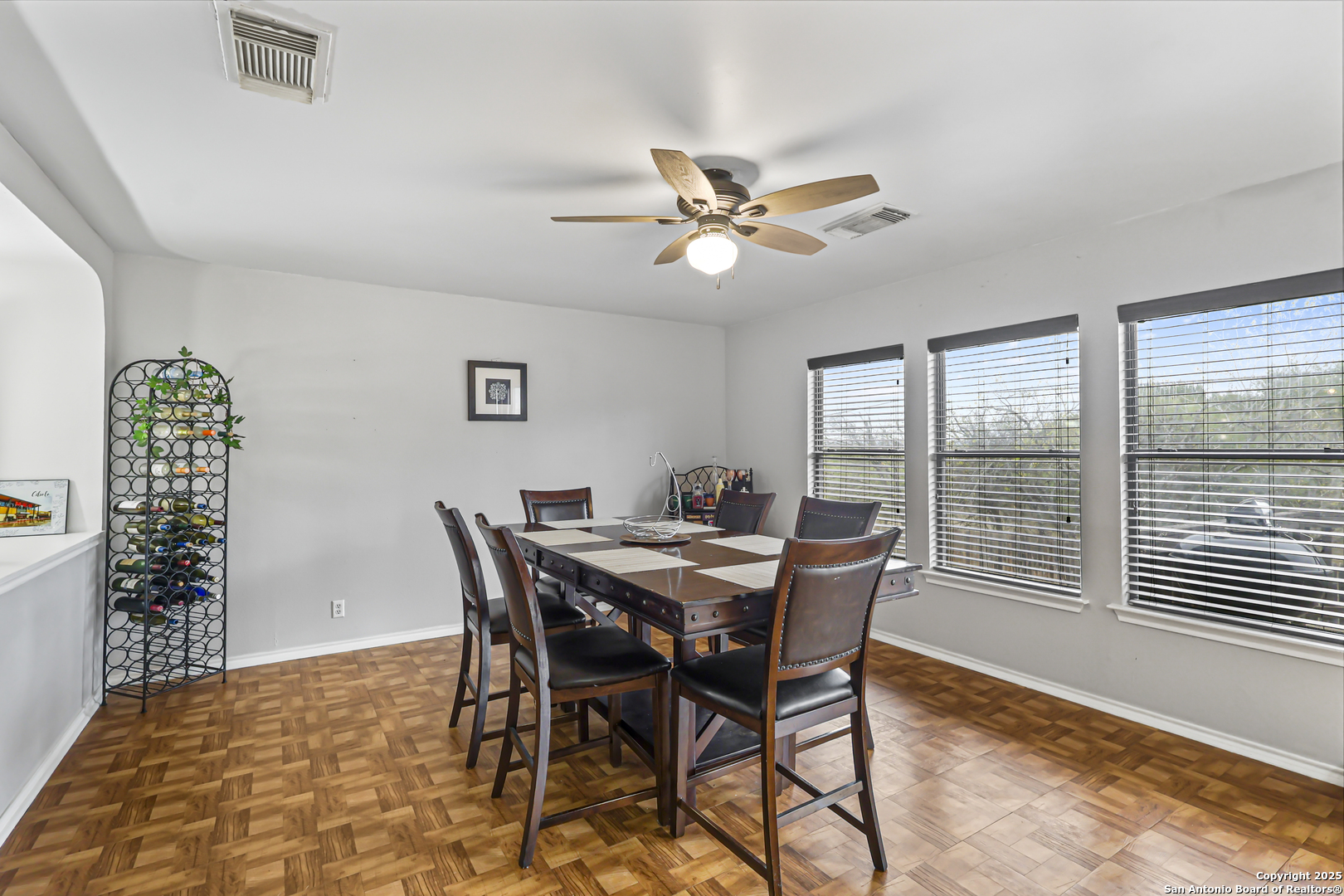 7234 Raintree Forest San Antonio, TX 78233 - Photo 8 of 23 a view of a dining room with furniture window and wooden floor