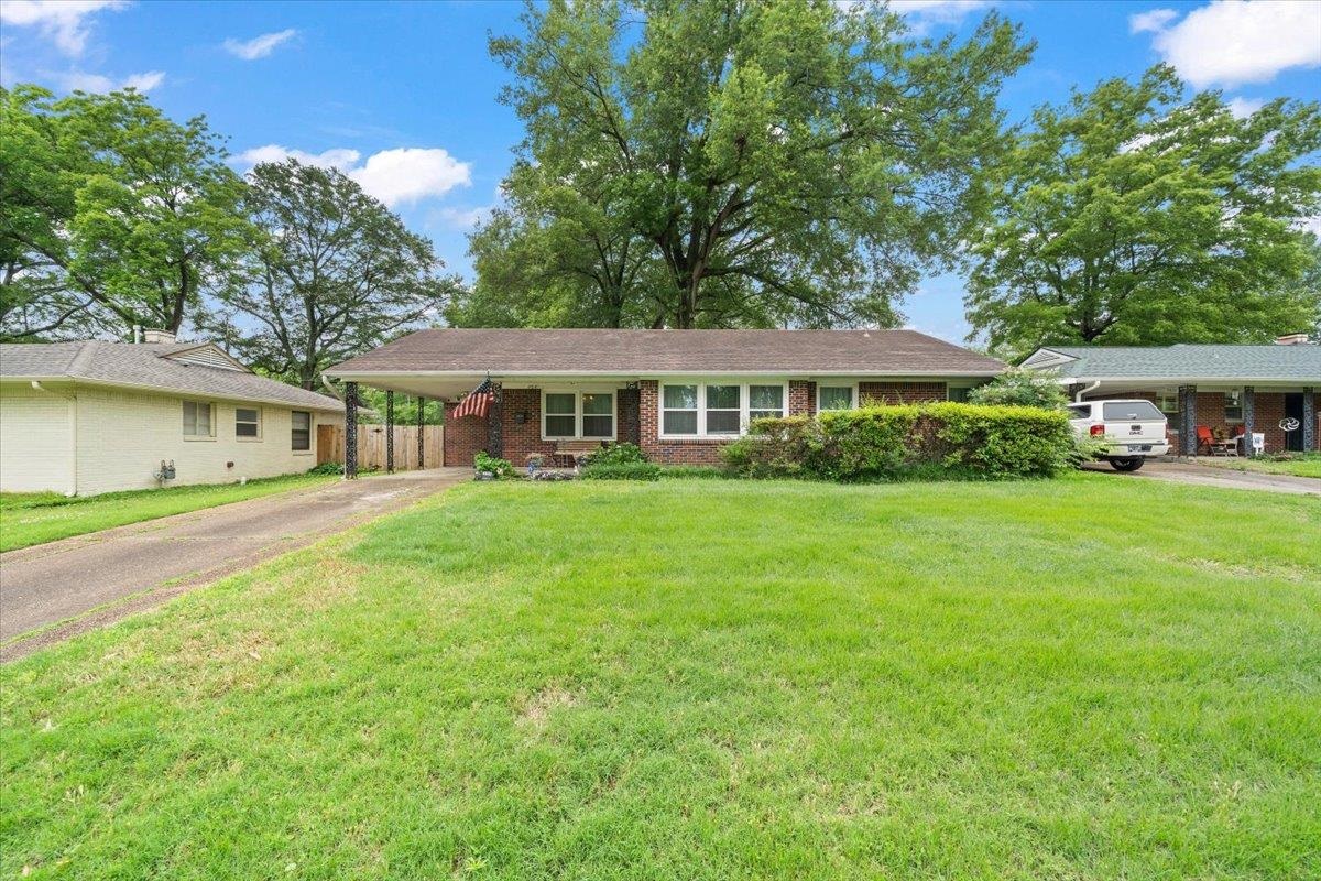 4841 Dee Road Memphis, TN 38117 - Photo 2 of 28 Ranch-style house with asphalt driveway, an attached carport, and brick siding