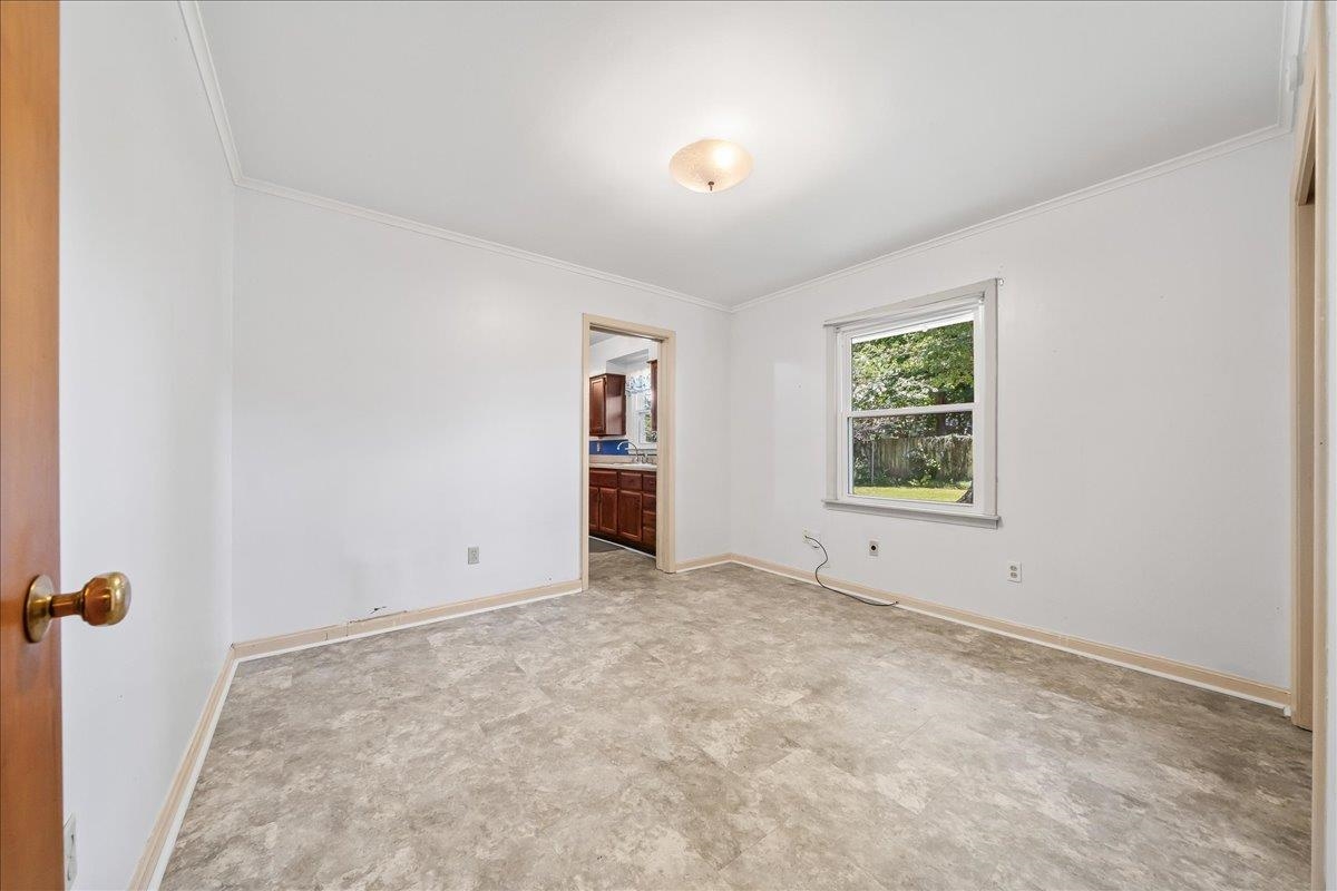 4841 Dee Road Memphis, TN 38117 - Photo 24 of 28 Empty room with crown molding and light carpet