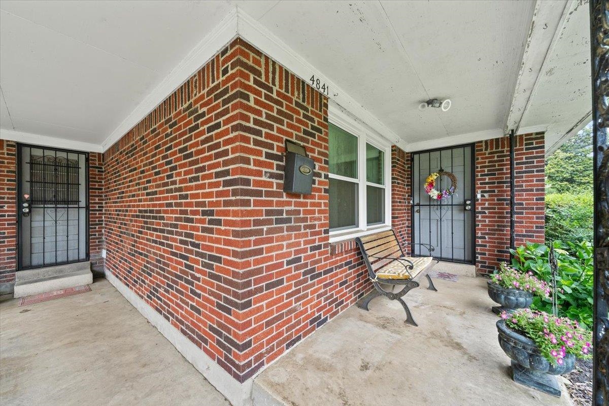 4841 Dee Road Memphis, TN 38117 - Photo 5 of 28 Entrance to property with brick siding and covered porch