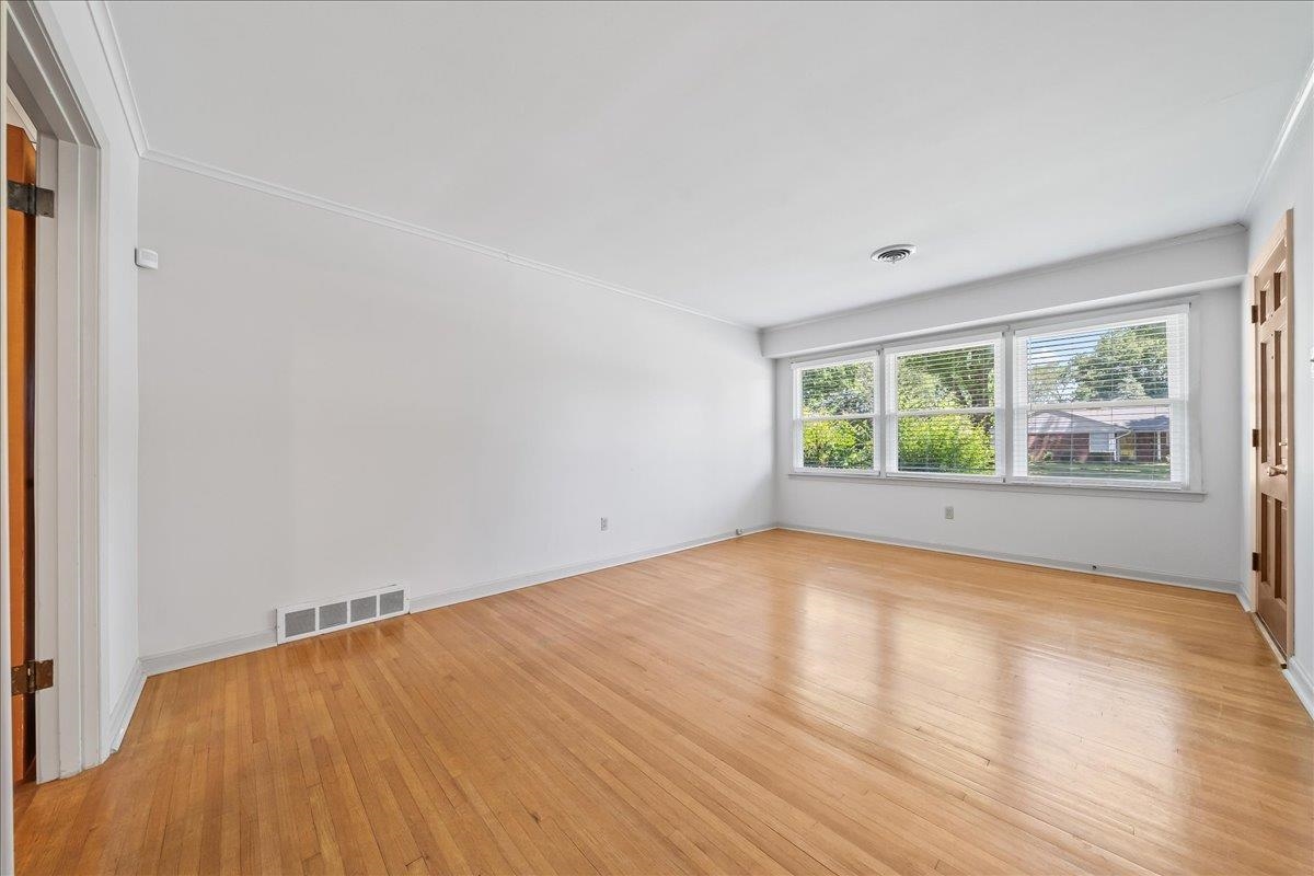 4841 Dee Road Memphis, TN 38117 - Photo 8 of 28 Unfurnished room with light wood-style flooring and ornamental molding