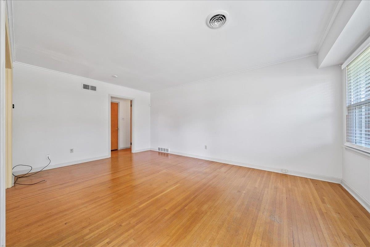 4841 Dee Road Memphis, TN 38117 - Photo 9 of 28 Empty room featuring crown molding and light wood-type flooring