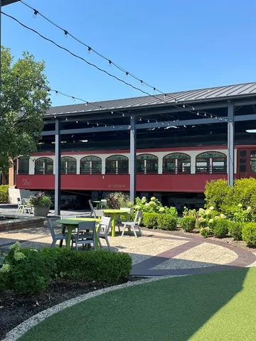 a view of brick building with a yard
