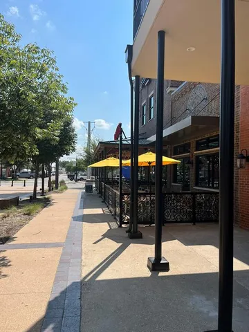 a view of a street with benches