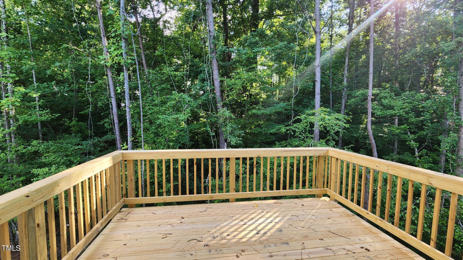 3125 White Memorial Church Road Willow Spring, NC 27592 - Photo 50 of 56 120 SF deck facing wooded private backyard