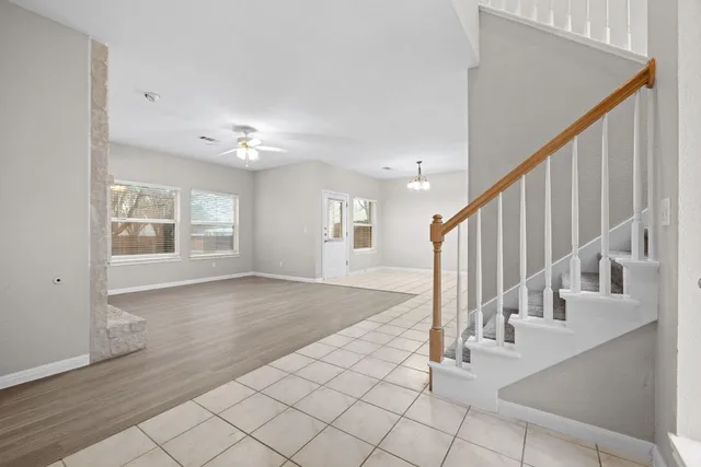 a view of an entryway with wooden floor and door