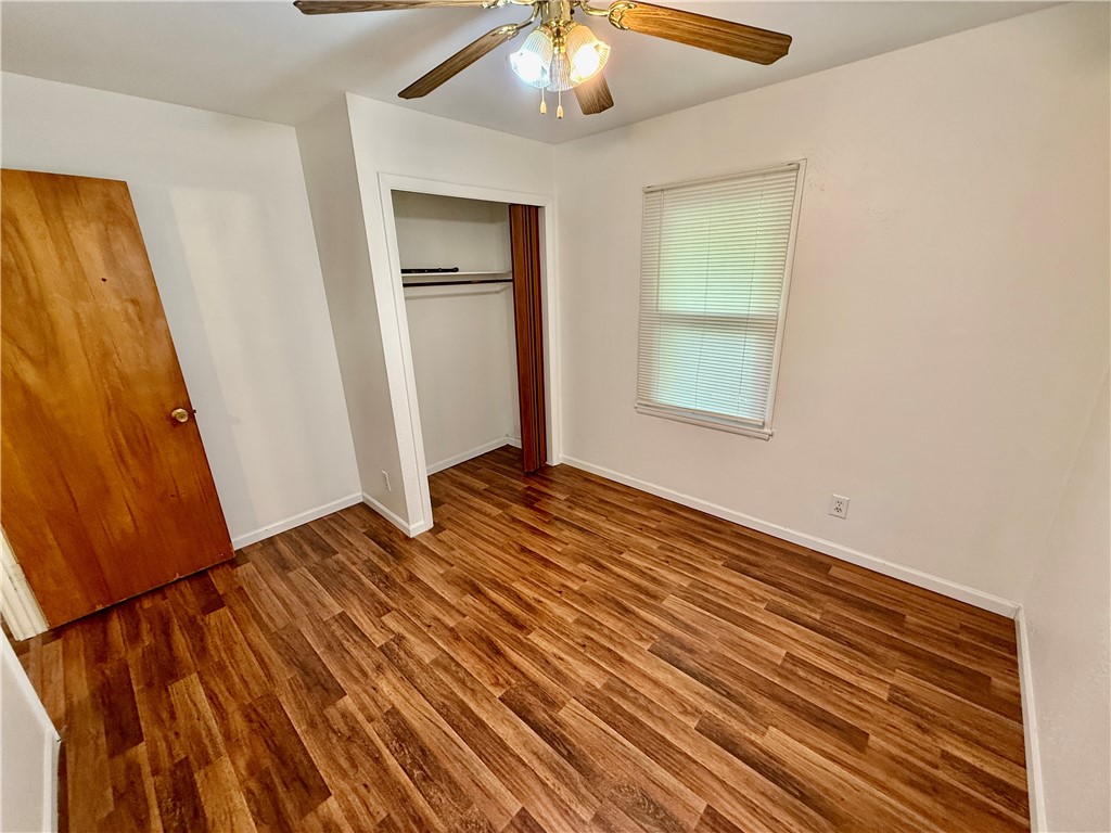 127 Isabella Drive Decatur, IL 62521 - Photo 10 of 16 a view of an empty room with wooden floor and a window