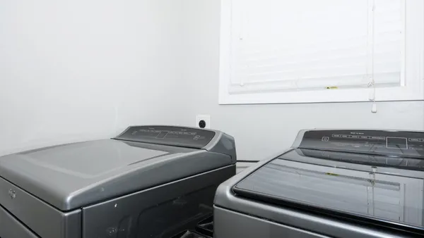 a room with a bed and a flat screen tv