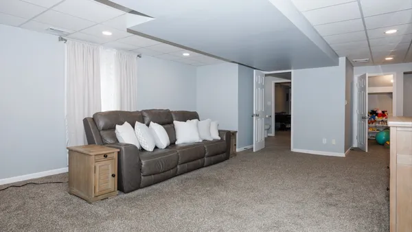 a living room with a fireplace and a flat screen tv