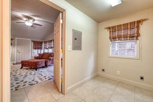 a bedroom with furniture and a chandelier