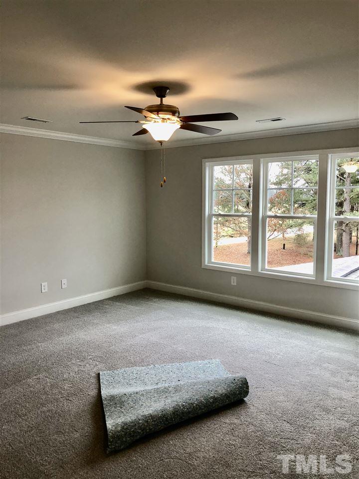 6941 Hill Road Spring Hope, NC 27882 - Photo 22 of 29 a living room with furniture and a large window