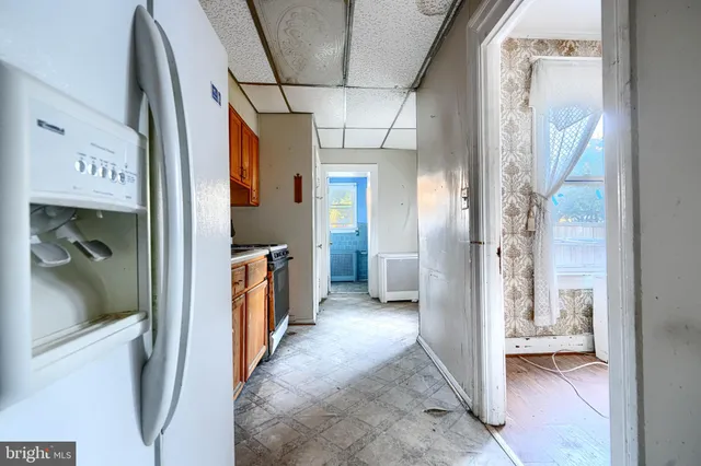 a kitchen with stainless steel appliances granite countertop a stove and a refrigerator